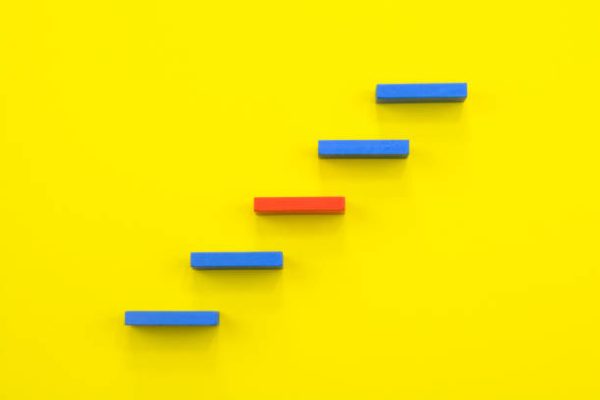 Steps to Success. Blue and Red steps on a yellow background.
