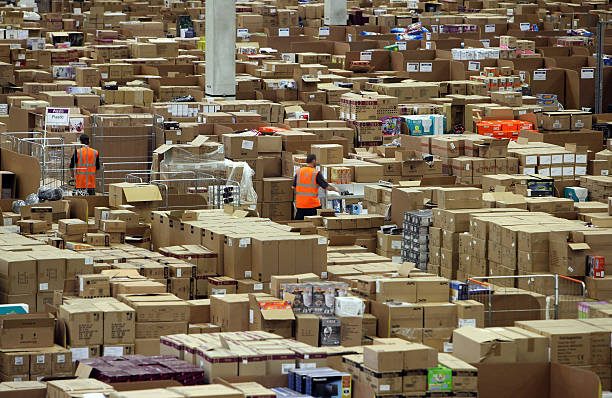 SWANSEA, WALES - NOVEMBER 26:  Staff at the Amazon Swansea fulfilment centre process orders as they prepare for what is expected to be their busiest Christmas on record on November 26, 2010 in Swansea, Wales. The 800,000 sq ft fulfilment centre, the largest of Amazon's six in the UK and one of the largest in the world, is gearing up for 'Cyber Monday', which this year is Monday December 6, and is predicted to be the busiest online shopping day of the year. In 2009, Cyber Monday saw 2 million orders received at a rate of 23 orders per second.  (Photo by Matt Cardy/Getty Images)